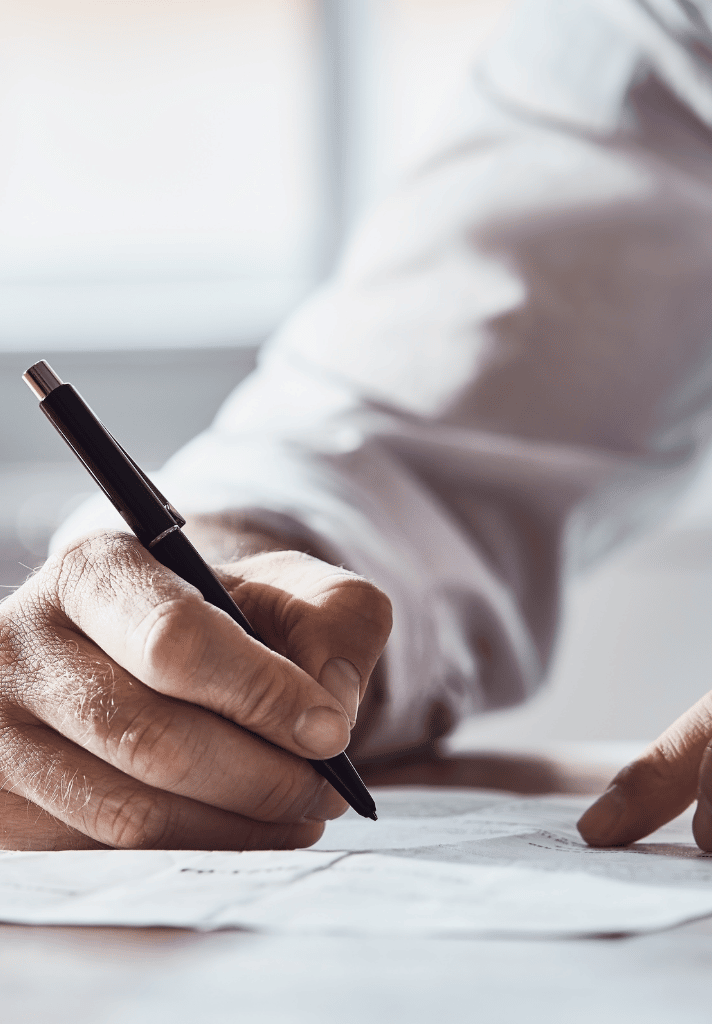 client is signing papers with lawyer