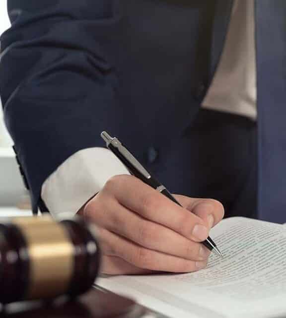 Criminal Defense attorney is signing papers with client